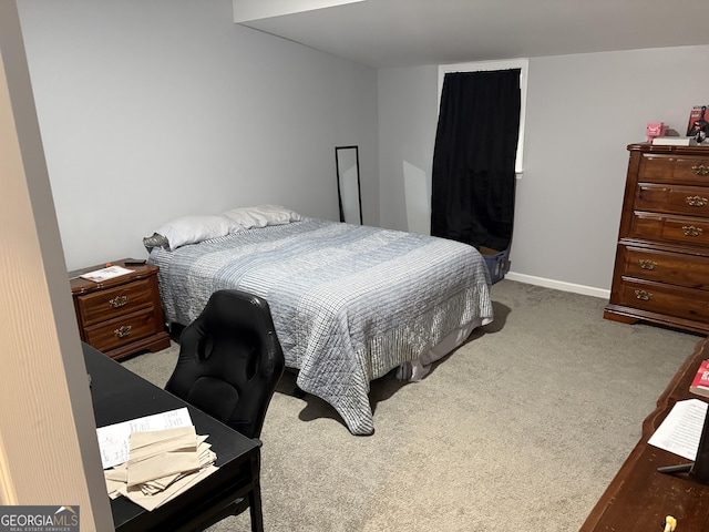 bedroom with baseboards and carpet flooring