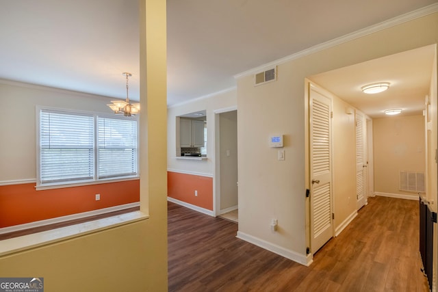 177 Amherst Pl NW, Atlanta, GA 30327 - corridor featuring wood finished floors, a notable chandelier, baseboards, and visible vents