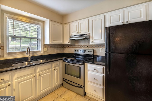 177 Amherst Pl NW, Atlanta, GA 30327 - kitchen with a sink, freestanding refrigerator, tasteful backsplash, under cabinet range hood, and stainless steel electric range oven