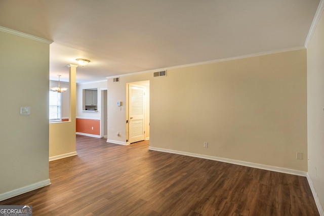 177 Amherst Pl NW, Atlanta, GA 30327 - spare room with a notable chandelier, baseboards, visible vents, ornamental molding, and dark wood-style flooring