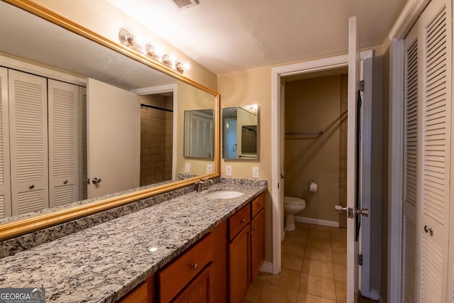 177 Amherst Pl NW, Atlanta, GA 30327 - full bath with toilet, vanity, tile patterned floors, and a closet