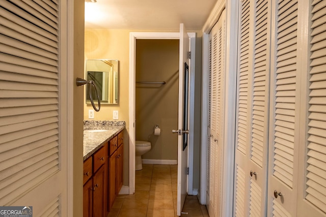 177 Amherst Pl NW, Atlanta, GA 30327 - bathroom featuring a closet, toilet, tile patterned flooring, and vanity