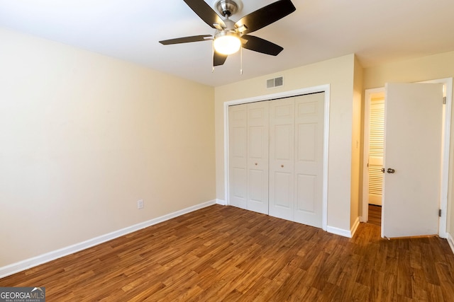 177 Amherst Pl NW, Atlanta, GA 30327 - unfurnished bedroom with baseboards, visible vents, a ceiling fan, a closet, and wood finished floors