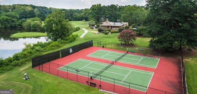 177 Amherst Pl NW, Atlanta, GA 30327 - view of tennis court featuring a water view, fence, and a yard