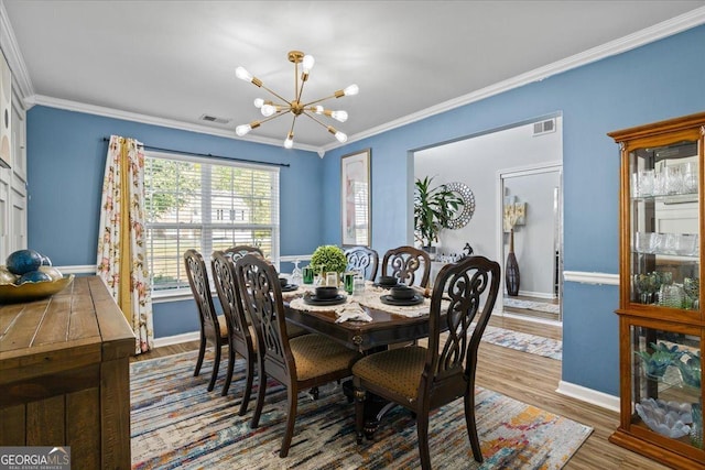 dining space featuring baseboards, a notable chandelier, and visible vents