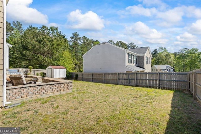 view of yard with a fenced backyard, an outdoor structure, and a storage shed