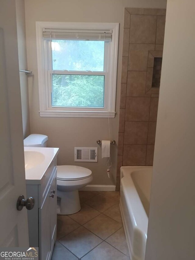 full bath featuring visible vents, a bathtub, toilet, tile patterned floors, and vanity