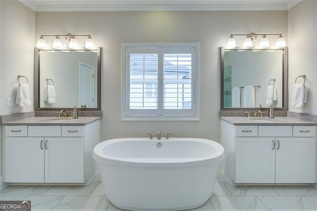 bathroom featuring two vanities, marble finish floor, a sink, and ornamental molding