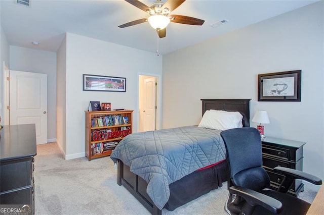 bedroom featuring light carpet, visible vents, baseboards, and ceiling fan