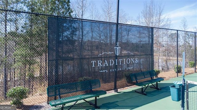 view of property's community featuring fence