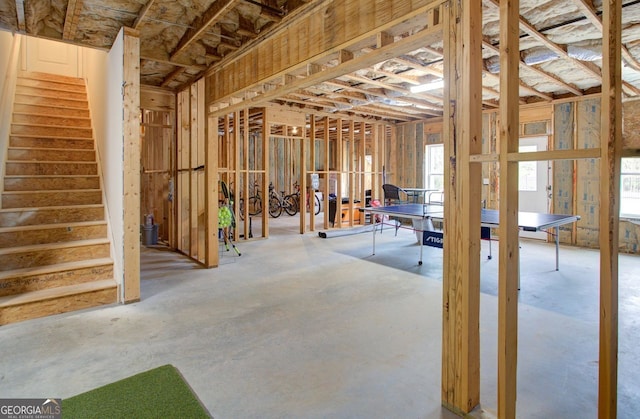 miscellaneous room with a wealth of natural light and stairway