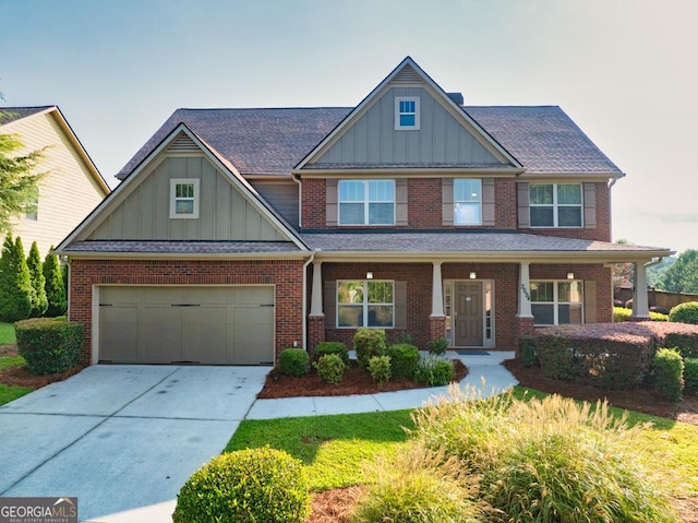 2694 Dawning Day Dr, Dacula, GA 30019 - craftsman house featuring brick siding, a garage, board and batten siding, and concrete driveway