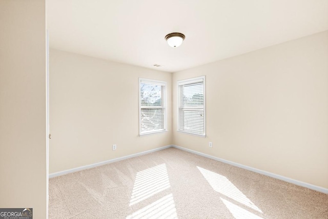 2694 Dawning Day Dr, Dacula, GA 30019 - unfurnished room with baseboards, visible vents, and light carpet
