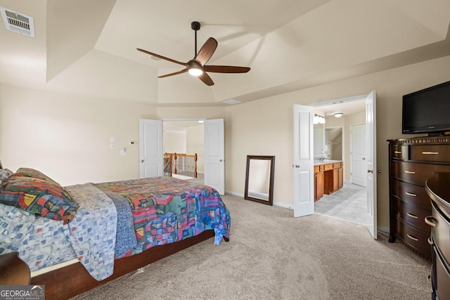 2694 Dawning Day Dr, Dacula, GA 30019 - bedroom with visible vents, light carpet, baseboards, a raised ceiling, and a ceiling fan
