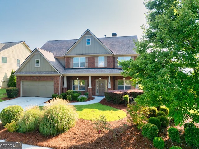 2694 Dawning Day Dr, Dacula, GA 30019 - craftsman inspired home with a front lawn, brick siding, board and batten siding, concrete driveway, and covered porch
