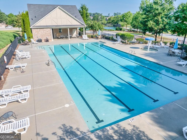 2694 Dawning Day Dr, Dacula, GA 30019 - community pool with fence and a patio area