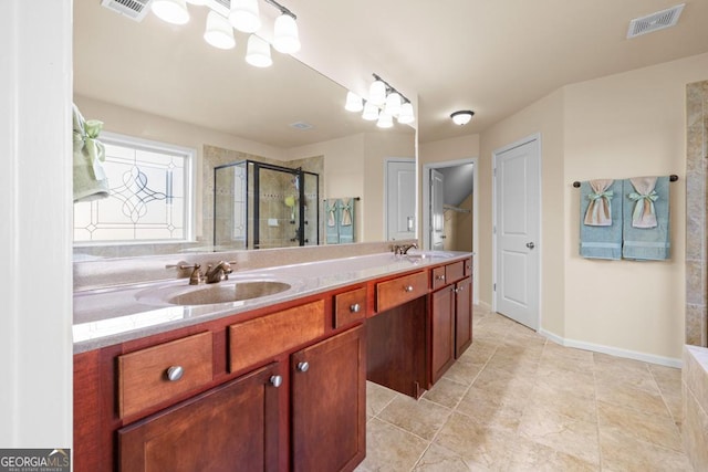 2694 Dawning Day Dr, Dacula, GA 30019 - bathroom featuring visible vents, a shower stall, and a sink
