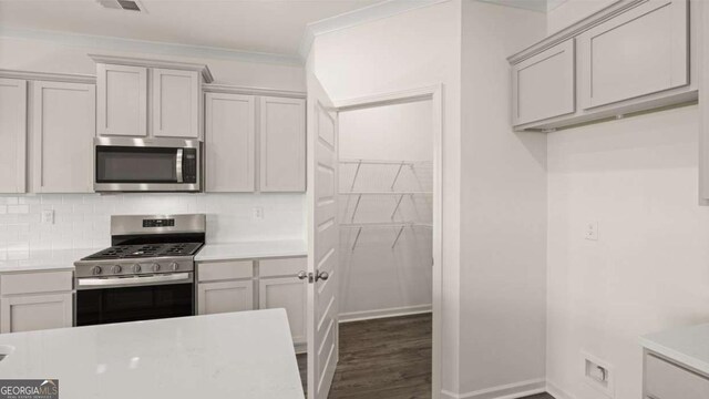 kitchen featuring light countertops and stainless steel appliances