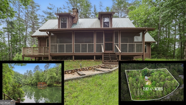80 Lake Forest Ct, Lakemont, GA 30552 - back of property with a sunroom, metal roof, a chimney, and a water view