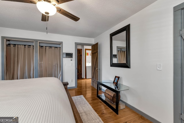80 Lake Forest Ct, Lakemont, GA 30552 - bedroom with baseboards, light wood-style floors, a textured ceiling, and a ceiling fan
