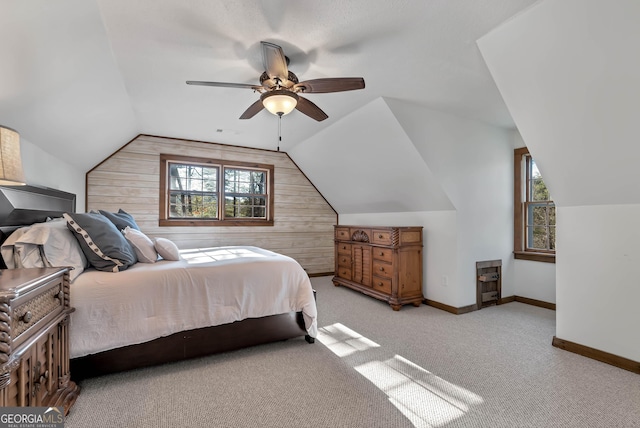 80 Lake Forest Ct, Lakemont, GA 30552 - bedroom with lofted ceiling, wooden walls, light carpet, baseboards, and ceiling fan