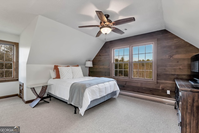 80 Lake Forest Ct, Lakemont, GA 30552 - bedroom featuring wooden walls, vaulted ceiling, multiple windows, carpet floors, and ceiling fan