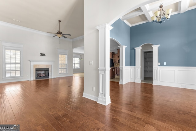 157 Wessex Dr, Bonaire, GA 31005 - unfurnished living room with a ceiling fan, a premium fireplace, a towering ceiling, a chandelier, and hardwood / wood-style floors