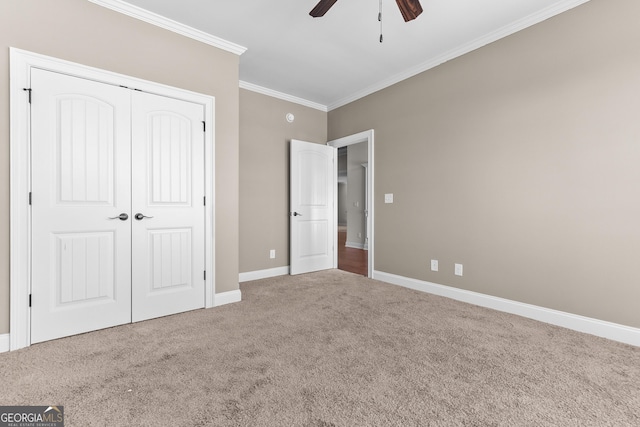 157 Wessex Dr, Bonaire, GA 31005 - unfurnished bedroom with carpet floors, ornamental molding, a closet, and a ceiling fan