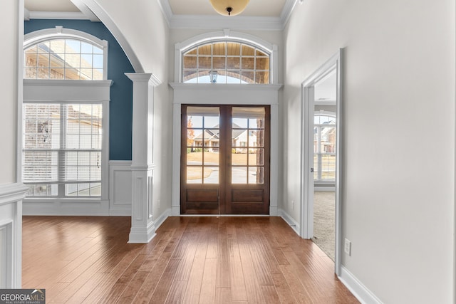157 Wessex Dr, Bonaire, GA 31005 - entryway featuring decorative columns, french doors, hardwood / wood-style floors, and ornamental molding