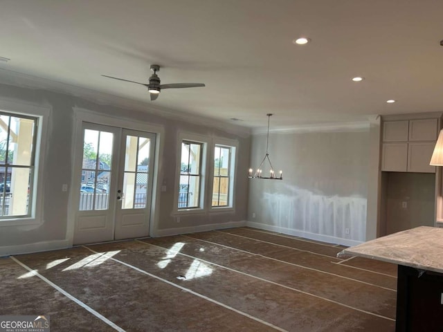 unfurnished dining area featuring baseboards, ornamental molding, recessed lighting, and plenty of natural light
