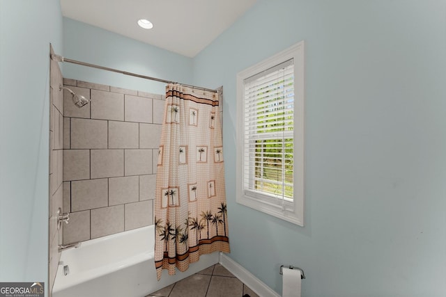 full bathroom featuring baseboards, shower / tub combo with curtain, tile patterned flooring, and plenty of natural light