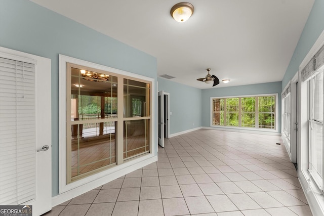 unfurnished sunroom with a notable chandelier and visible vents