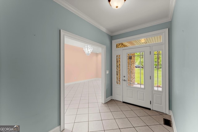entryway with crown molding, light tile patterned floors, baseboards, and an inviting chandelier