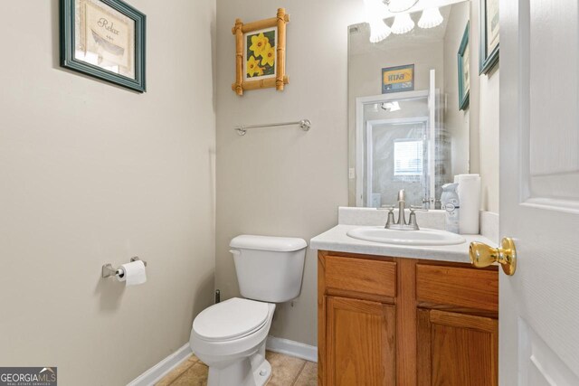 726 Fir Chase, Fairburn, GA 30213 - half bathroom featuring toilet, vanity, baseboards, and tile patterned flooring