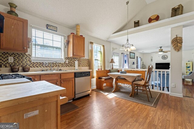 726 Fir Chase, Fairburn, GA 30213 - kitchen featuring light countertops, wood finished floors, a sink, ceiling fan with notable chandelier, and stainless steel dishwasher