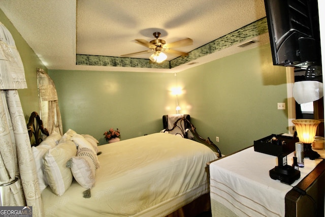 3789 Heatherwoods Dr, Valdosta, GA 31605 - bedroom with visible vents, a textured ceiling, and a ceiling fan