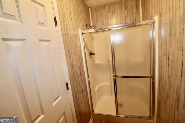 3789 Heatherwoods Dr, Valdosta, GA 31605 - bathroom with a shower stall and wooden walls