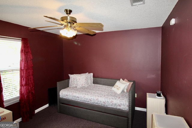 3789 Heatherwoods Dr, Valdosta, GA 31605 - carpeted bedroom featuring visible vents, baseboards, radiator heating unit, and ceiling fan