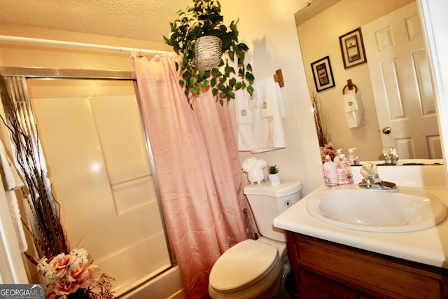 3789 Heatherwoods Dr, Valdosta, GA 31605 - bathroom featuring shower / tub combo, toilet, vanity, and a textured ceiling