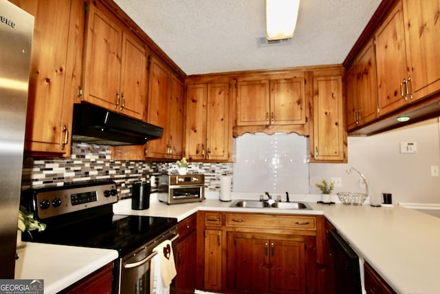 3789 Heatherwoods Dr, Valdosta, GA 31605 - kitchen featuring visible vents, a sink, appliances with stainless steel finishes, under cabinet range hood, and decorative backsplash