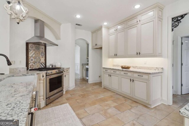 bar featuring stainless steel oven, recessed lighting, light tile patterned floors, a dry bar, and beverage cooler