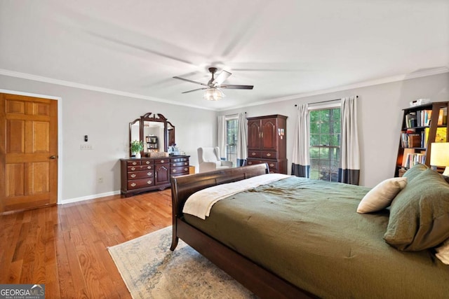 6695 Woodstock Rd, Acworth, GA 30102 - bedroom featuring light wood-style flooring, ornamental molding, baseboards, and ceiling fan