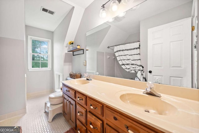 6695 Woodstock Rd, Acworth, GA 30102 - full bathroom featuring visible vents, toilet, tile patterned flooring, and a sink
