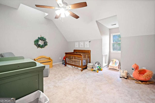 6695 Woodstock Rd, Acworth, GA 30102 - bedroom featuring carpet flooring, a nursery area, lofted ceiling, visible vents, and ceiling fan