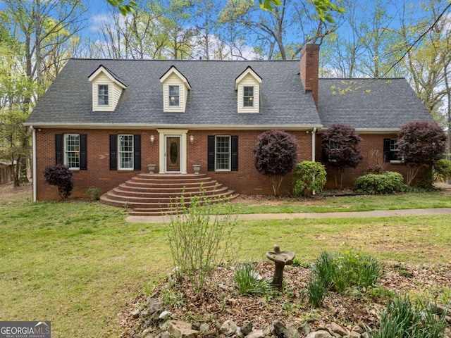 6695 Woodstock Rd, Acworth, GA 30102 - cape cod-style house featuring a shingled roof, a chimney, a front yard, and brick siding
