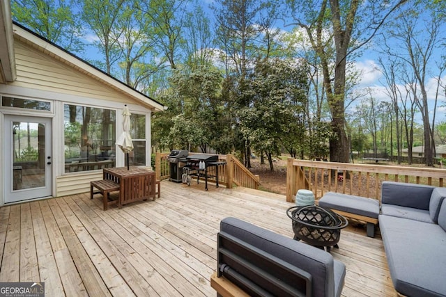 6695 Woodstock Rd, Acworth, GA 30102 - wooden deck with an outdoor living space with a fire pit, a sunroom, and grilling area