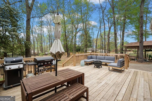 6695 Woodstock Rd, Acworth, GA 30102 - wooden terrace with a grill, outdoor dining area, and an outdoor living space with a fire pit