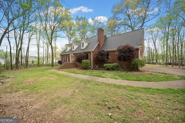 6695 Woodstock Rd, Acworth, GA 30102 - view of side of home featuring brick siding, a chimney, roof with shingles, and a yard