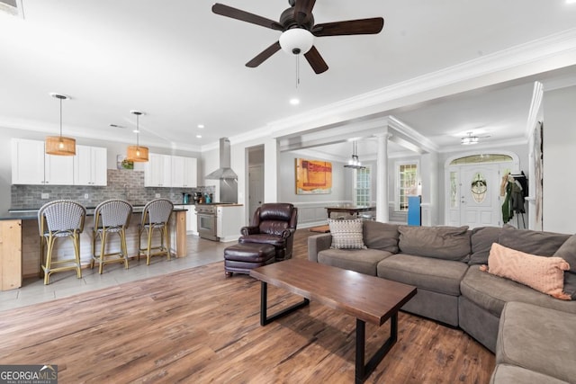 1081 Katherine Ln, Greensboro, GA 30642 - living area featuring a ceiling fan, light wood finished floors, ornamental molding, and recessed lighting