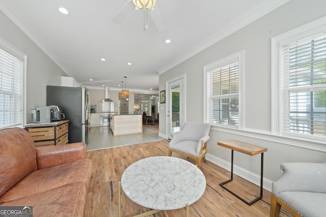 1081 Katherine Ln, Greensboro, GA 30642 - living room featuring a wealth of natural light, light wood-type flooring, and crown molding
